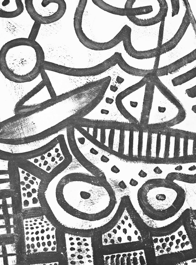 This photograph showcases a monochromatic collaged abstract piece set against a white background. it is the applocation of the gallery floor.